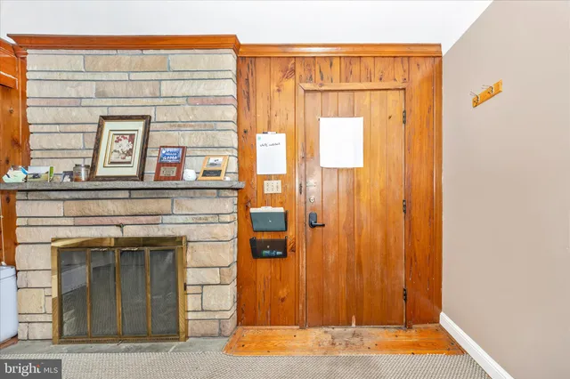 a view of a house with a snow in the background