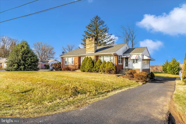 a view of a swimming pool with a house in the background