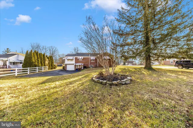 a backyard of a house with outdoor seating