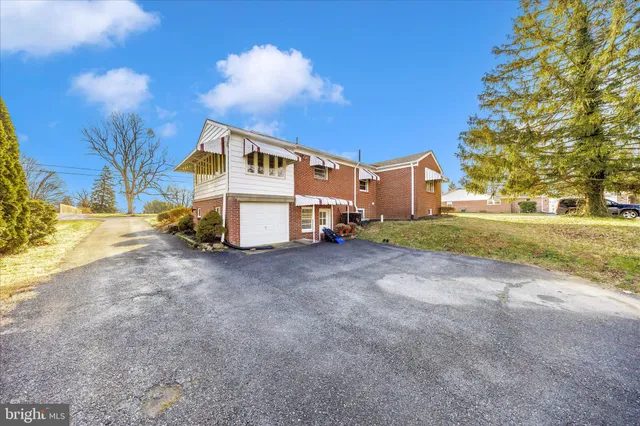 a view of a field with an trees in the background