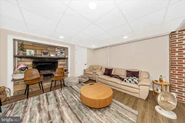 a living room with furniture and kitchen view