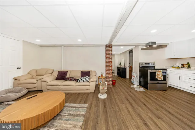 a bathroom with a sink vanity mirror and toilet