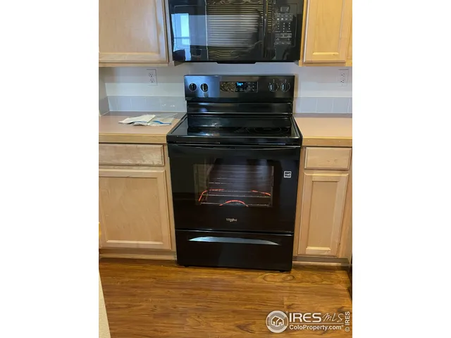 a kitchen with a stove and a microwave