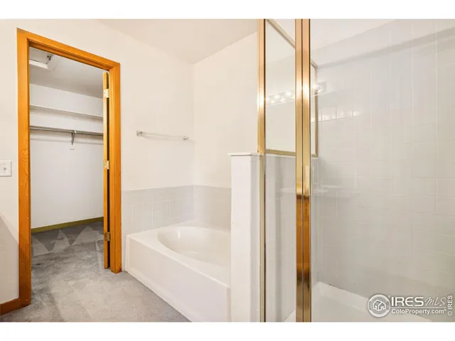 a bathroom with a bathtub and shower