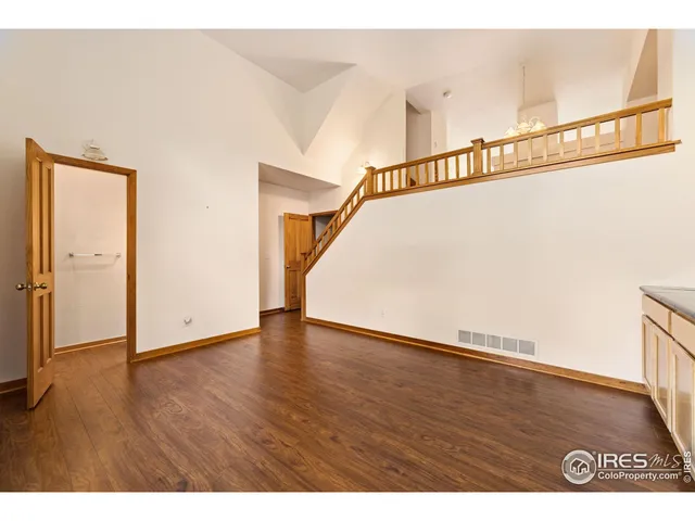 a view of an entryway with wooden floor