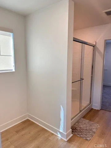 a view of entryway with wooden floor