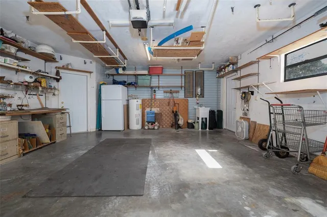 a view of empty room with wooden ceiling