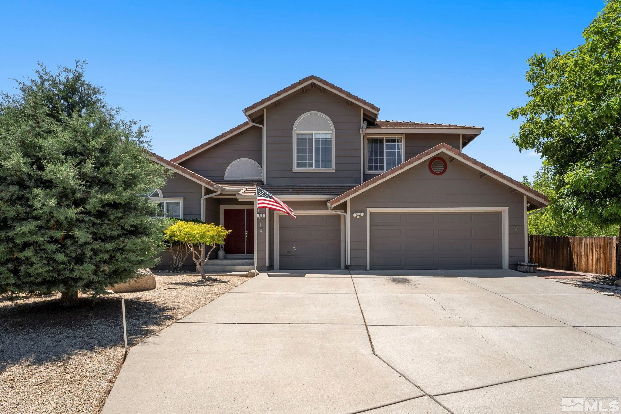 50 Deer Valley Court Reno, NV 89511 - Photo 1 of 39 a front view of a house with a garage
