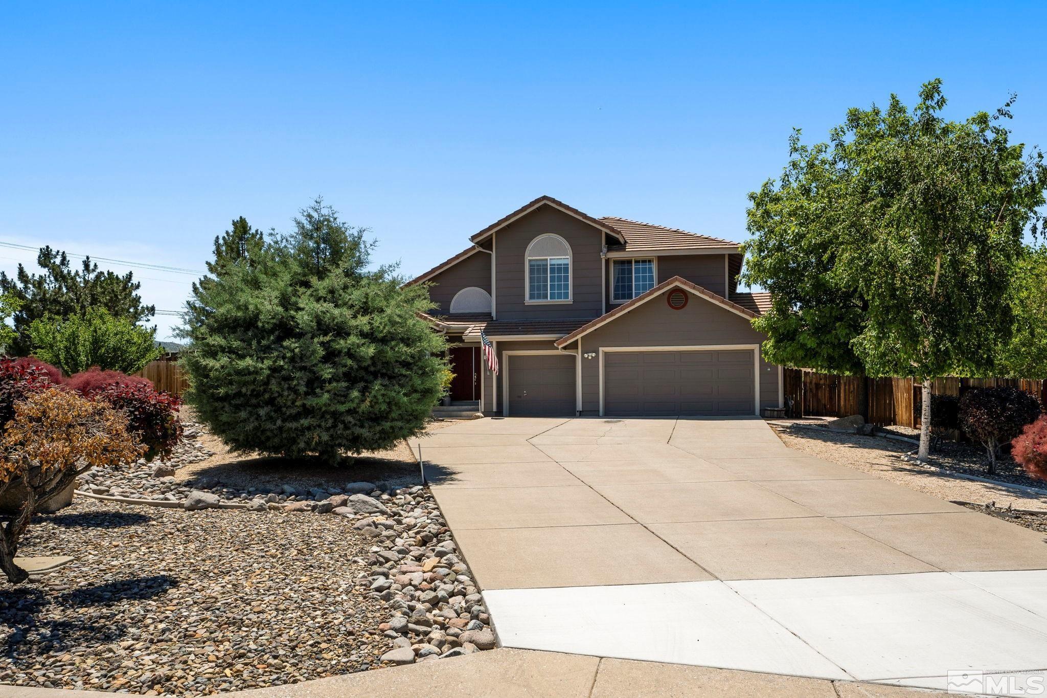 50 Deer Valley Court Reno, NV 89511 - Photo 2 of 39 a front view of a house with a yard