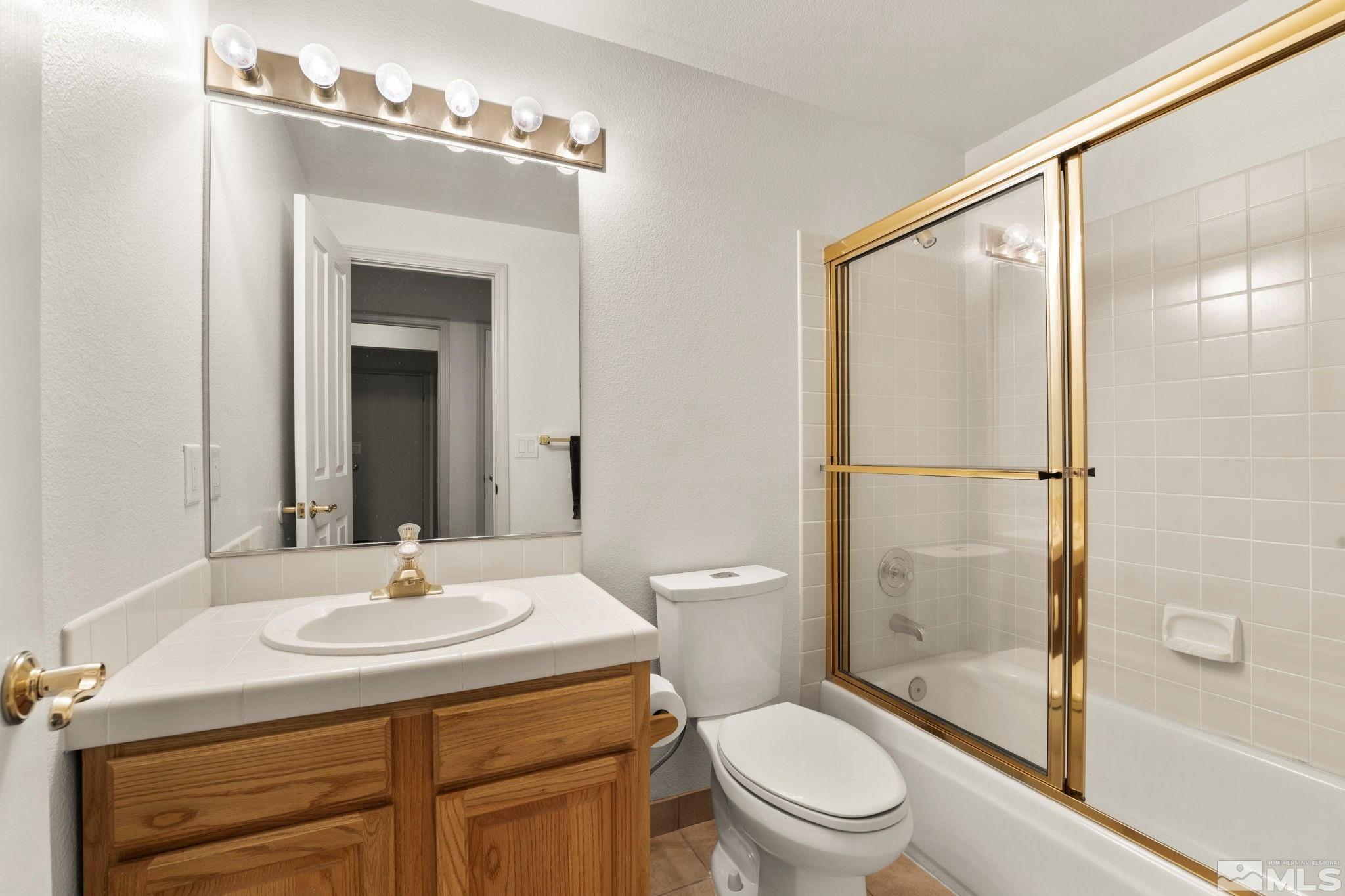 50 Deer Valley Court Reno, NV 89511 - Photo 25 of 39 a bathroom with a sink toilet and shower