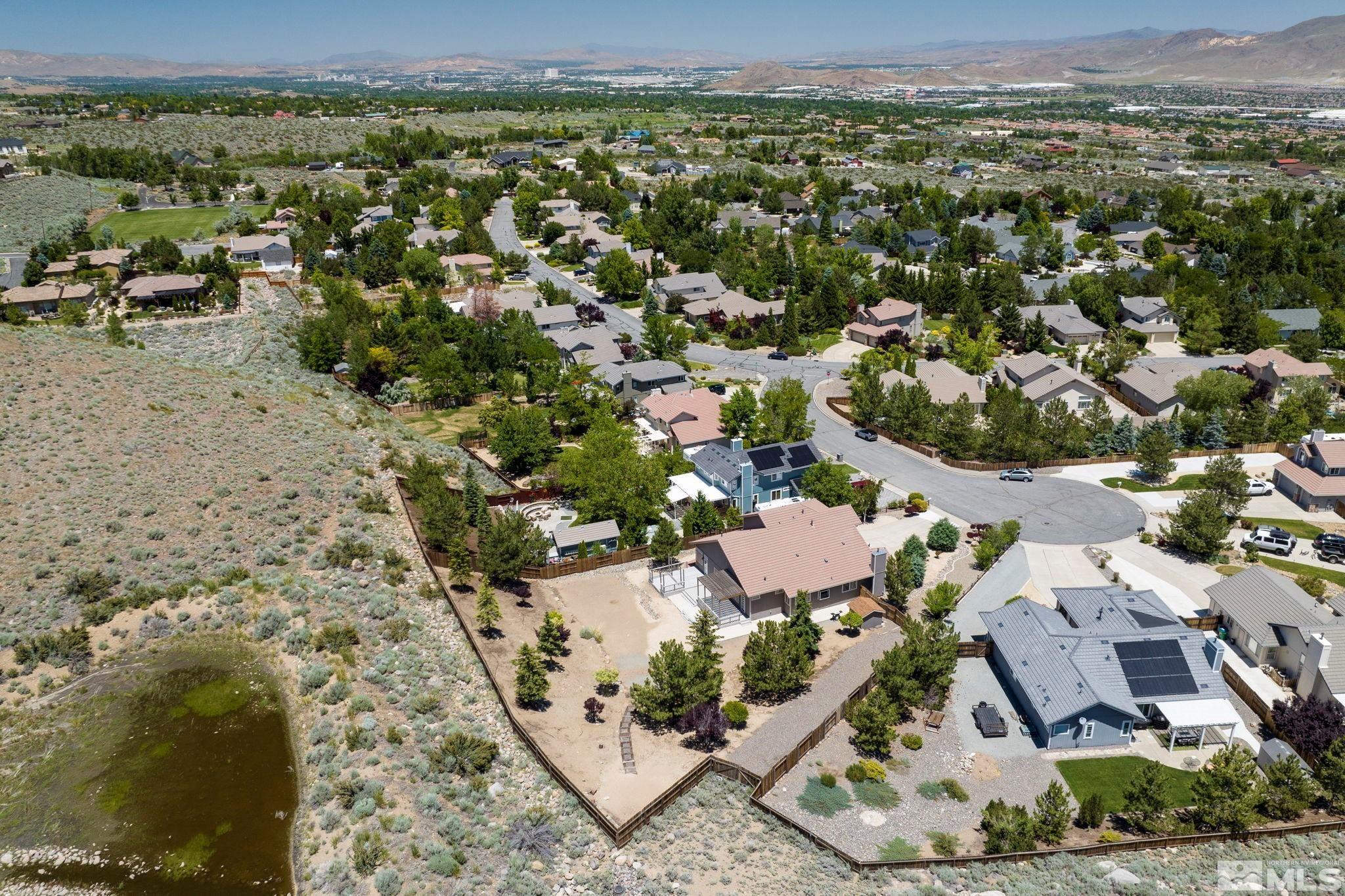 50 Deer Valley Court Reno, NV 89511 - Photo 37 of 39 an aerial view of residential houses with outdoor space