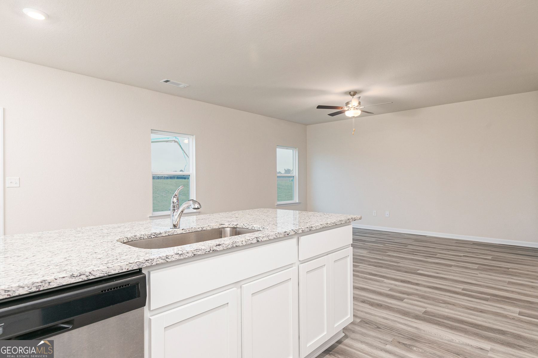 284 Limestone Circle Conyers, GA 30013 - Photo 12 of 25 a bathroom with a granite countertop sink and a mirror