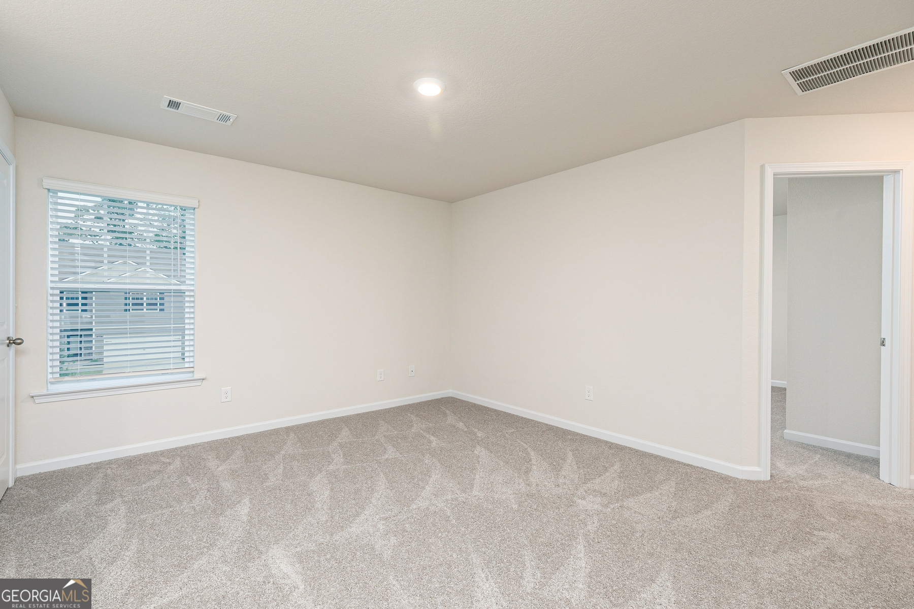 284 Limestone Circle Conyers, GA 30013 - Photo 15 of 25 an empty room with a window