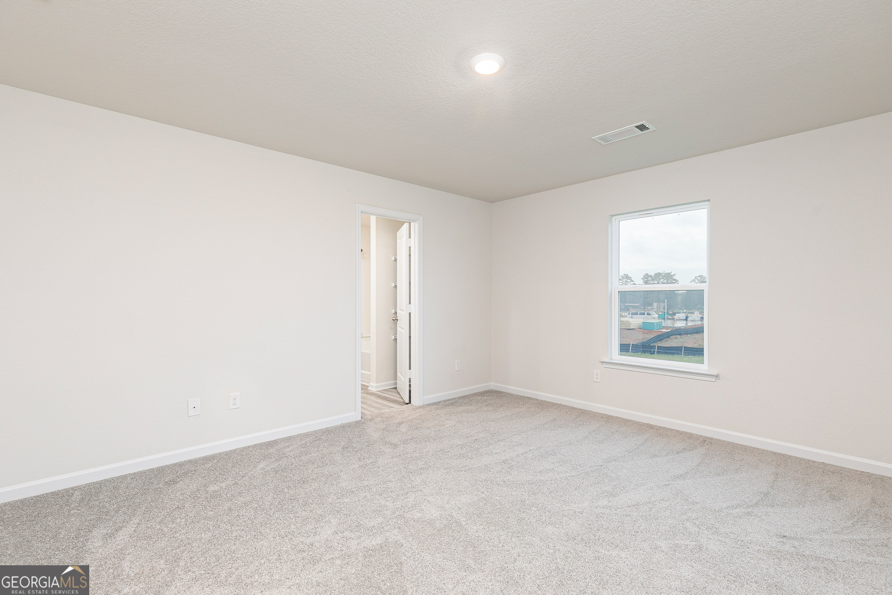 284 Limestone Circle Conyers, GA 30013 - Photo 16 of 25 an empty room with a window