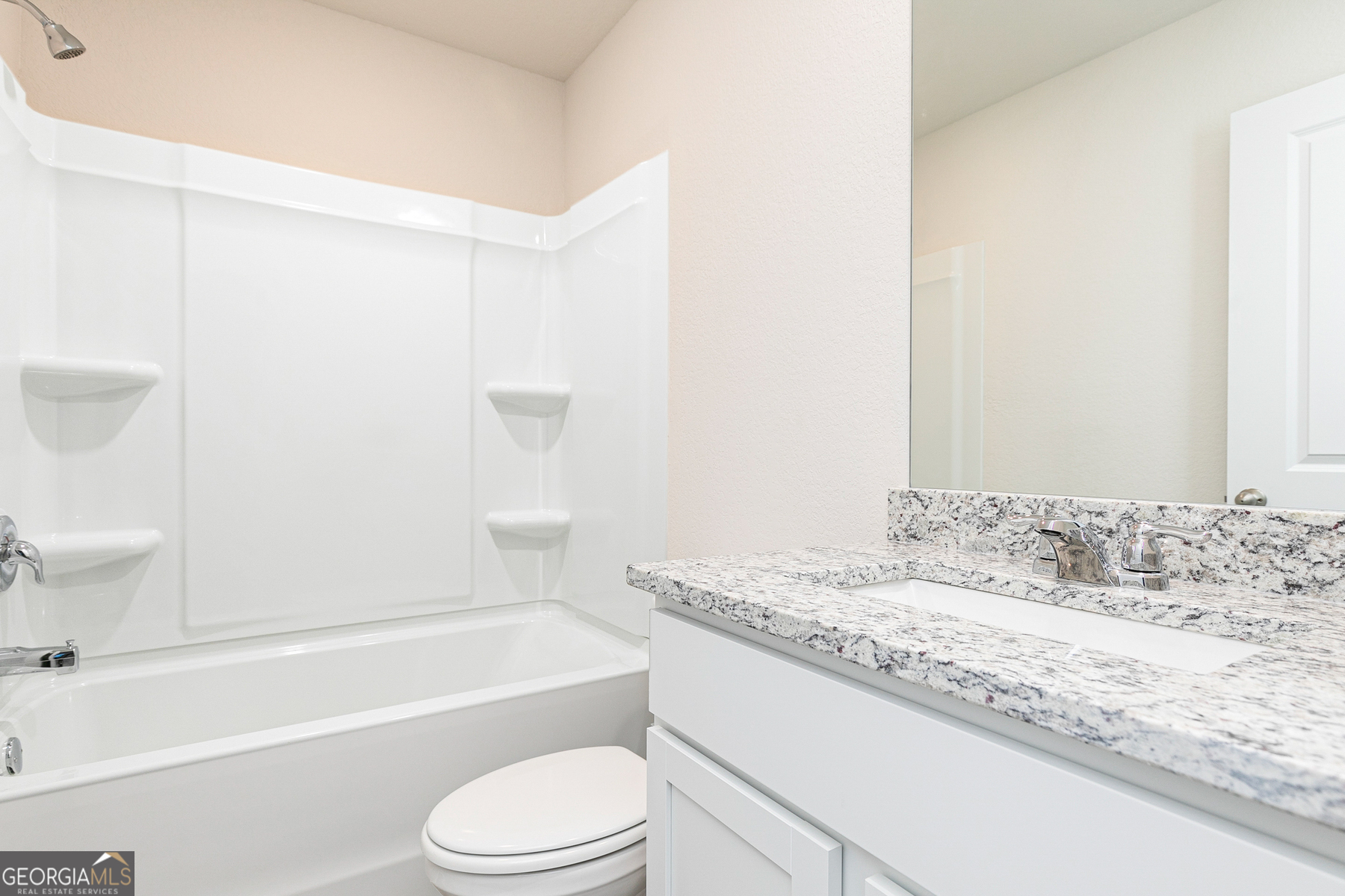 284 Limestone Circle Conyers, GA 30013 - Photo 25 of 25 a bathroom with a granite countertop sink toilet and shower