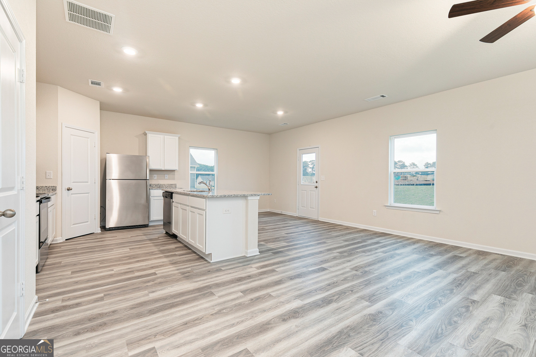 284 Limestone Circle Conyers, GA 30013 - Photo 5 of 25 a view of kitchen with wooden floor and electronic appliances