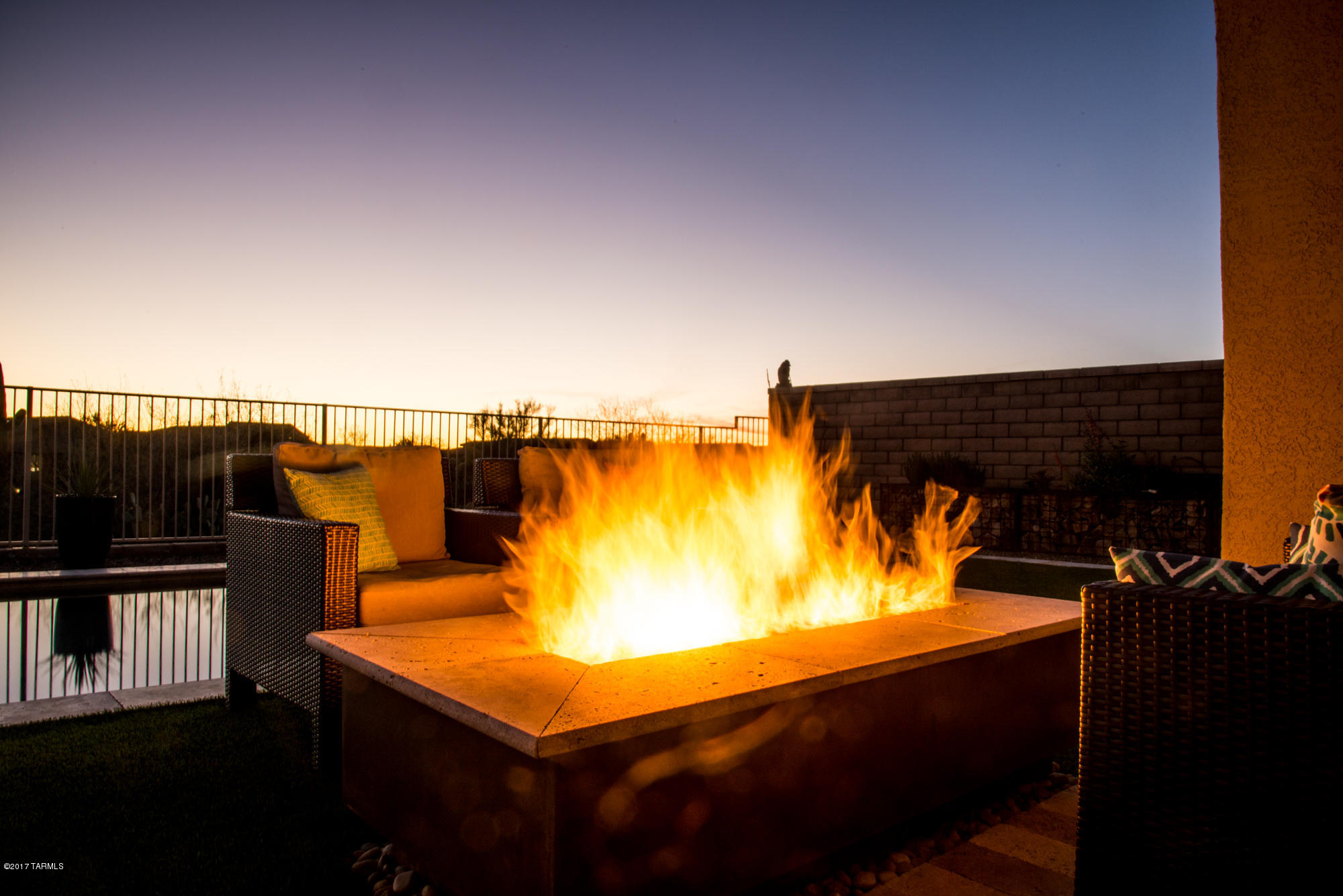 4405 West Crystal Ranch Place Marana, AZ 85658 - Photo 43 of 44 a view of a swimming pool with a table and chairs