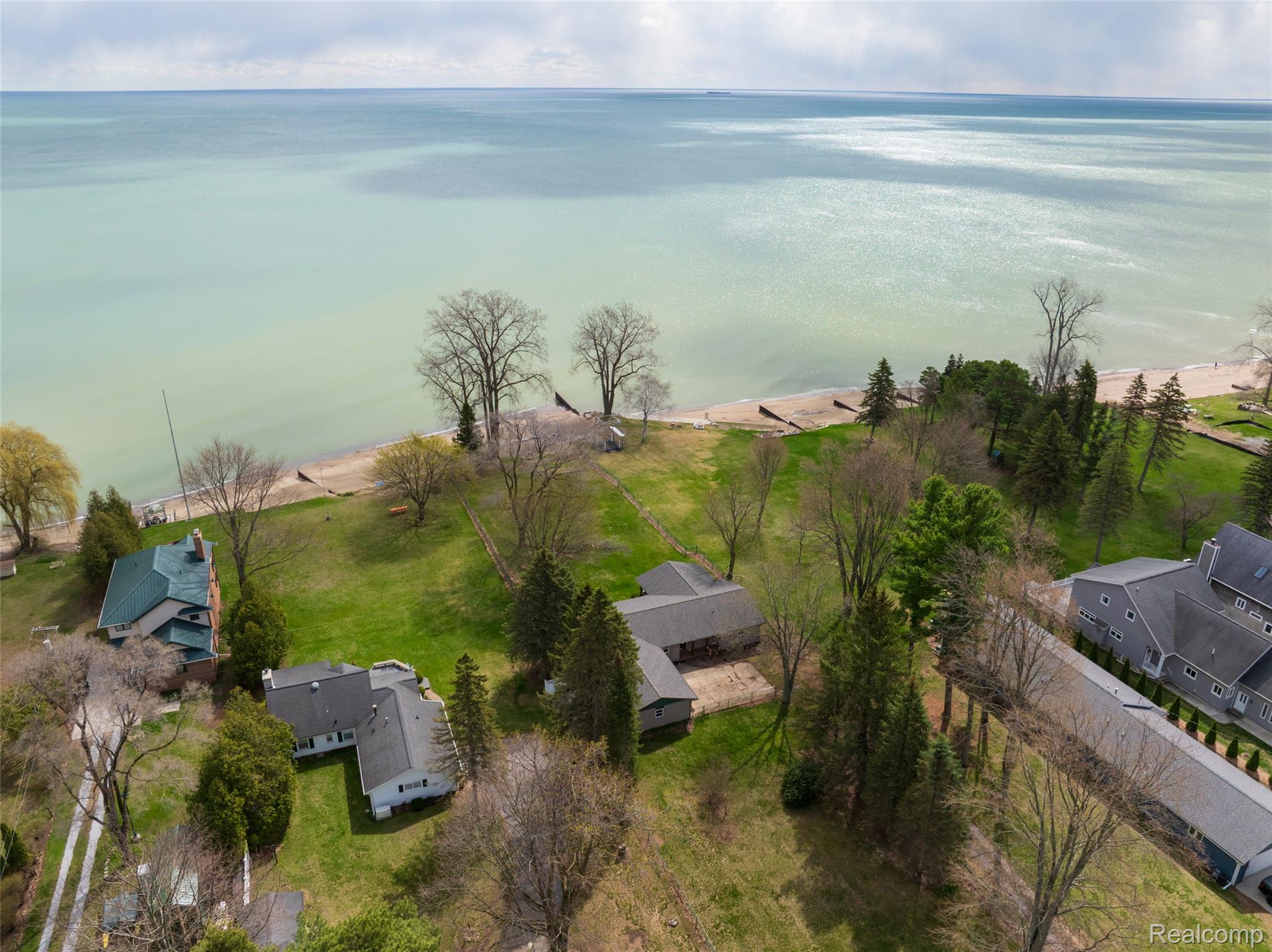 8171 Lakeshore Road Lexington, MI 48450 - Photo 37 of 45 Aerial perspective of suburban area featuring a nearby body of water
