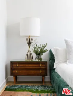 a bedroom with bed and window