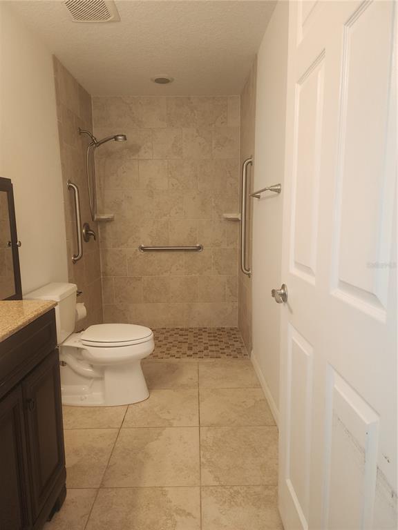 63 Estrella Road DeBary, FL 32713 - Photo 19 of 52 a bathroom with a toilet and a shower