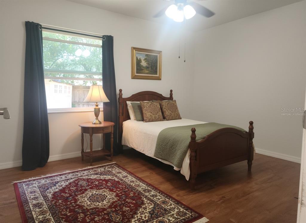 63 Estrella Road DeBary, FL 32713 - Photo 29 of 52 a bedroom with a large bed and a window