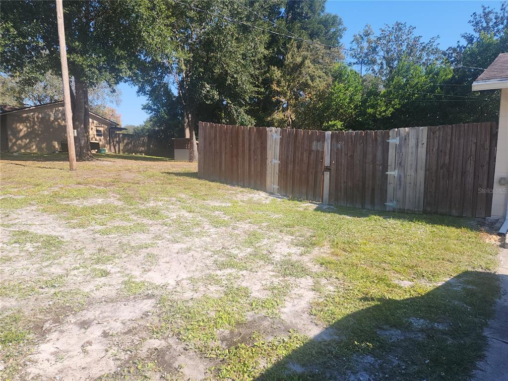 63 Estrella Road DeBary, FL 32713 - Photo 48 of 52 a view of swimming pool with wooden fence