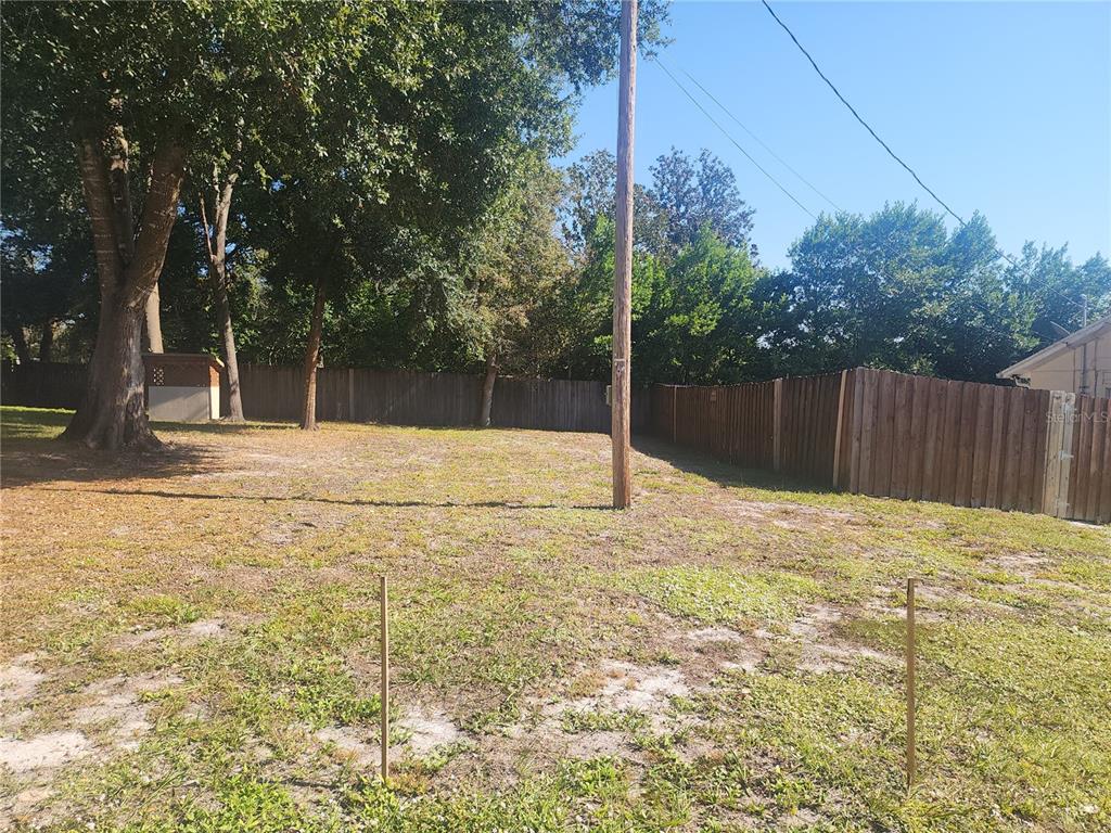 63 Estrella Road DeBary, FL 32713 - Photo 50 of 50 a swimming pool with trees in the background