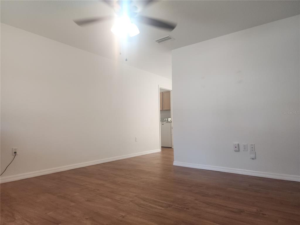 63 Estrella Road DeBary, FL 32713 - Photo 6 of 50 an empty room with wooden floor