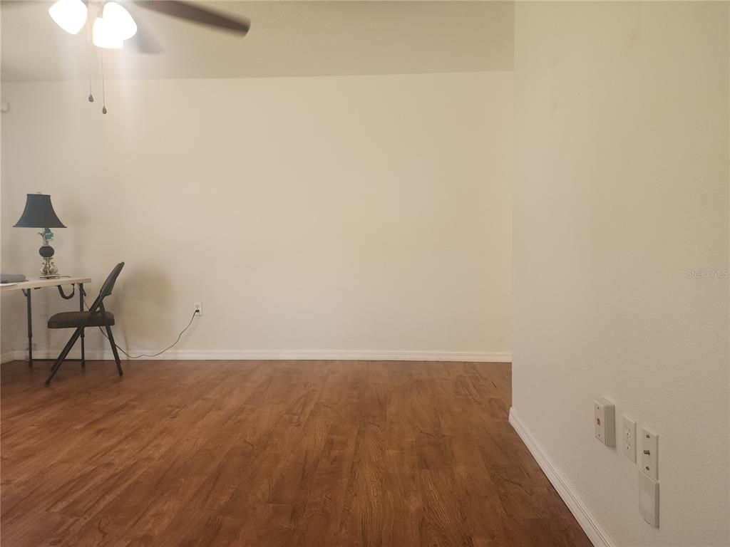 63 Estrella Road DeBary, FL 32713 - Photo 8 of 50 a view of room with wooden floor and bench