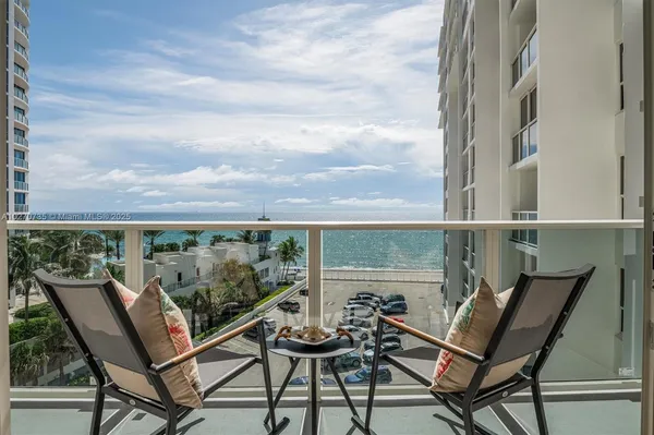 a view of a chairs and table on the terrace