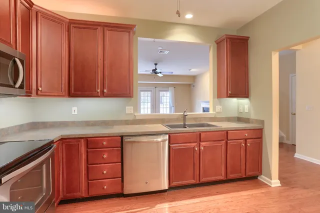 a kitchen with a sink and cabinets