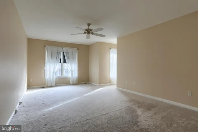 a view of empty room with windows