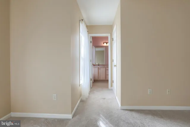 a view of a hallway with an empty room