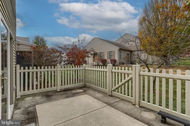 a view of a wrought iron fences in front of house