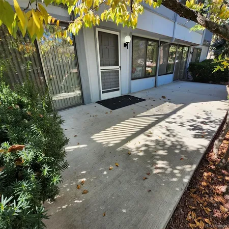 a view of a house with a tree in front of house