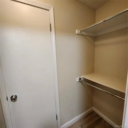 a bathroom with a sink and mirror with toilet