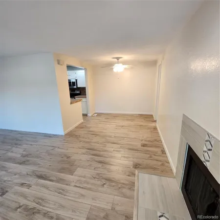 a kitchen with a sink a counter top space cabinets and stainless steel appliances