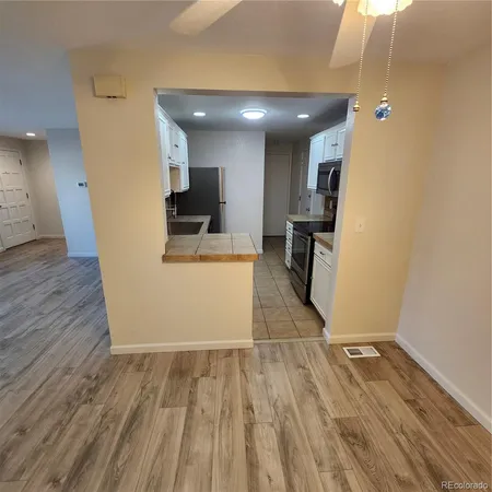 a kitchen with a sink cabinets and window