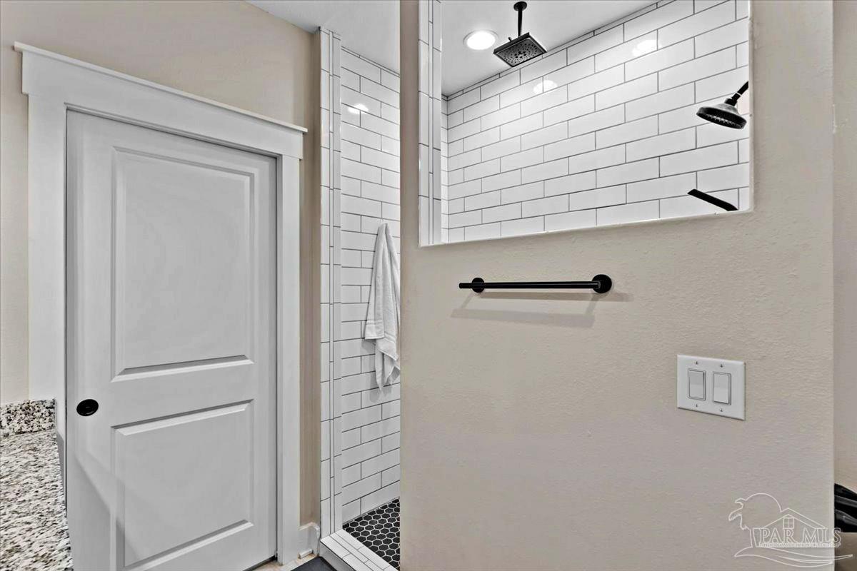 7400 Tidwell Road Pace, FL 32571 - Photo 13 of 36 a bathroom with a shower