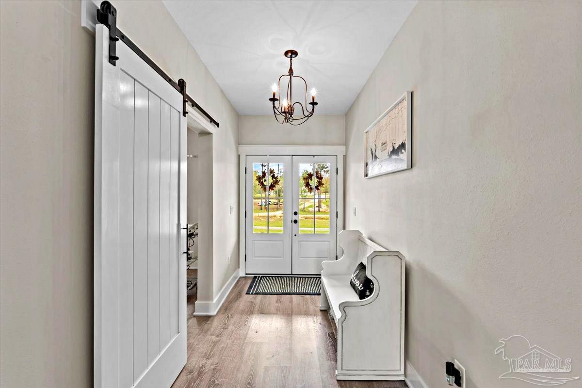 7400 Tidwell Road Pace, FL 32571 - Photo 14 of 36 a view of a hallway with windows