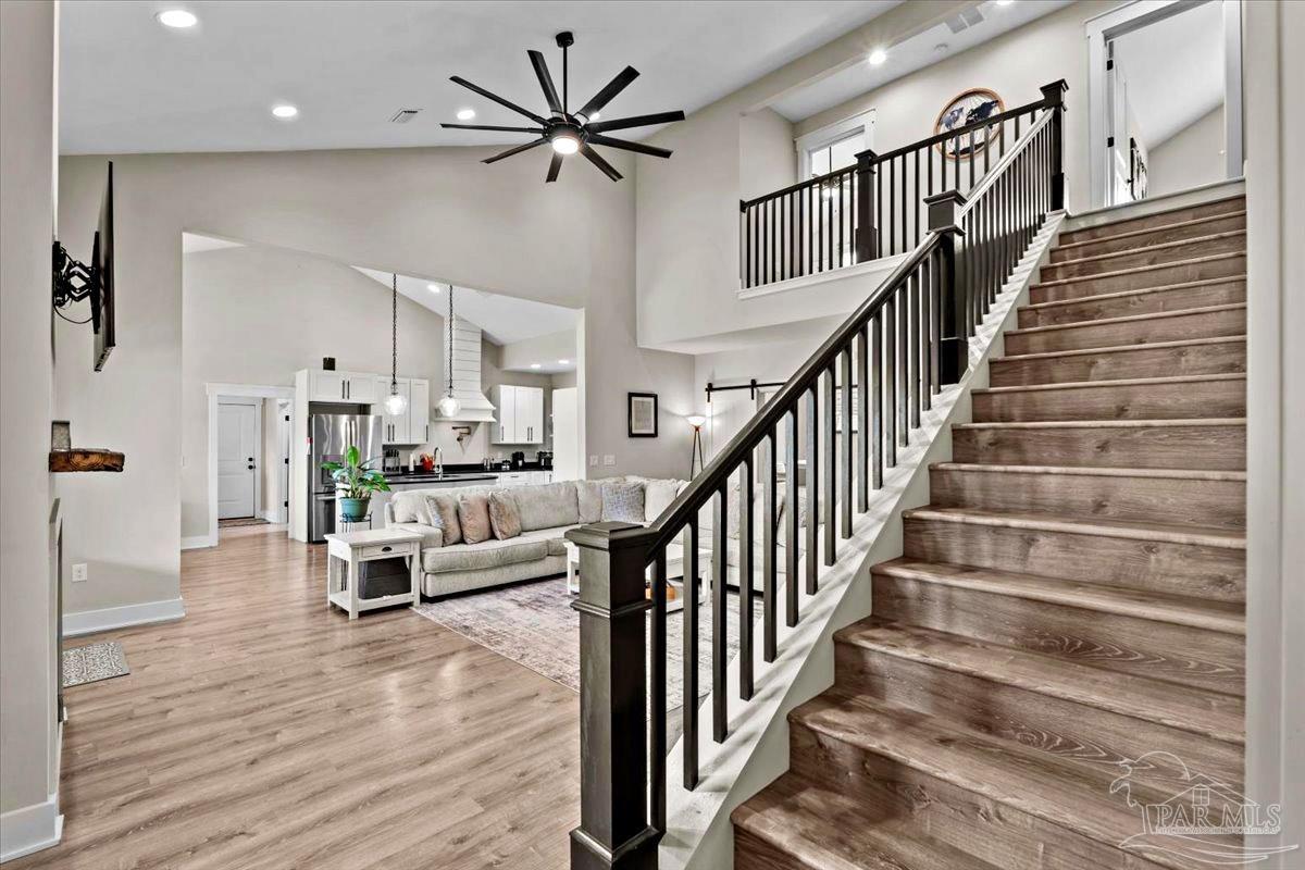 7400 Tidwell Road Pace, FL 32571 - Photo 19 of 36 a view of entryway and hall with wooden floor
