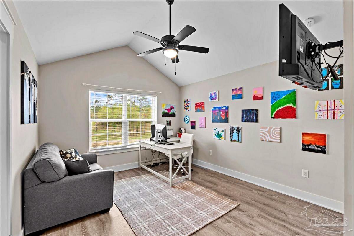 7400 Tidwell Road Pace, FL 32571 - Photo 25 of 36 a living room with furniture and a window