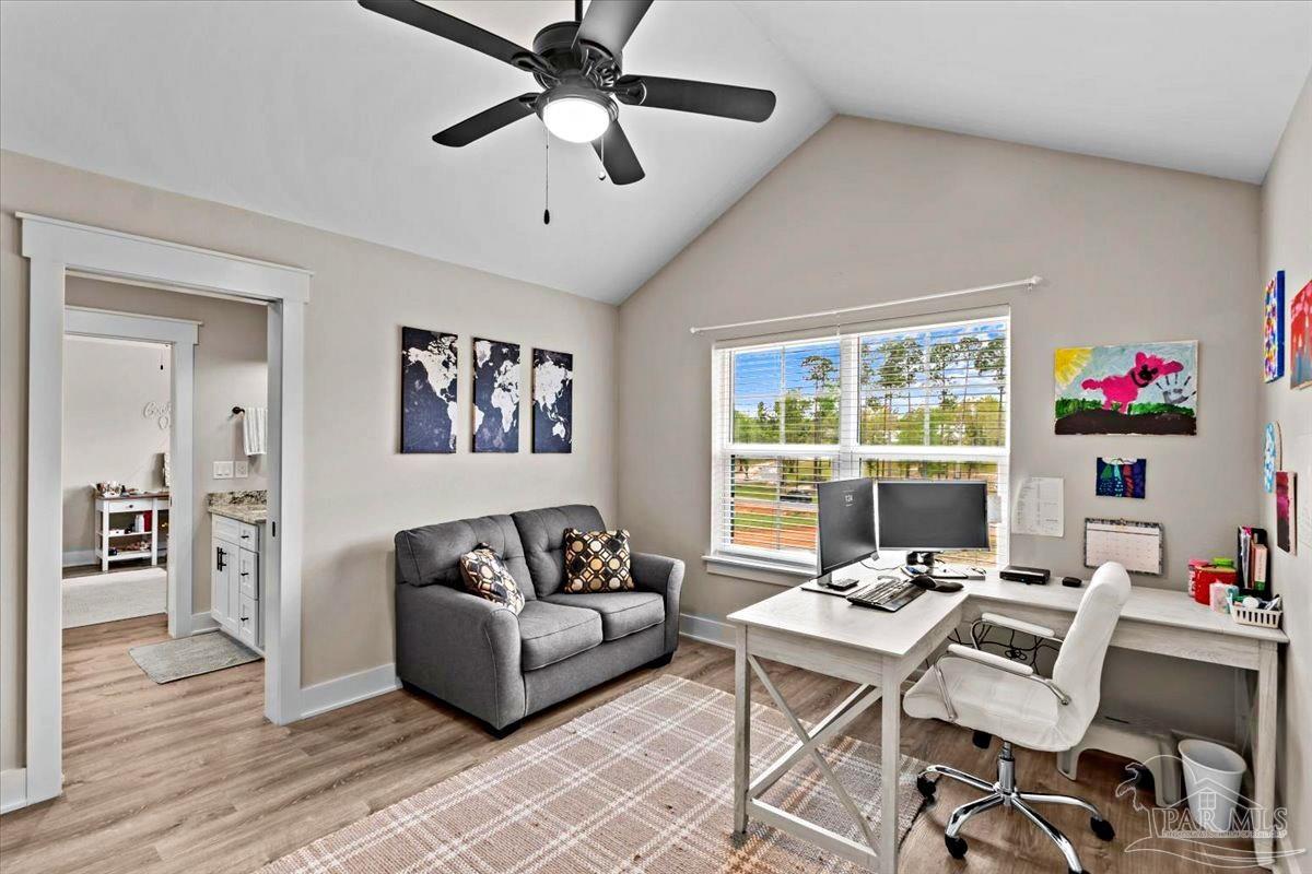 7400 Tidwell Road Pace, FL 32571 - Photo 26 of 36 a living room with furniture and a large window