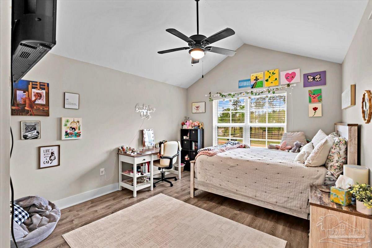 7400 Tidwell Road Pace, FL 32571 - Photo 27 of 36 a bed room with a bed and a window