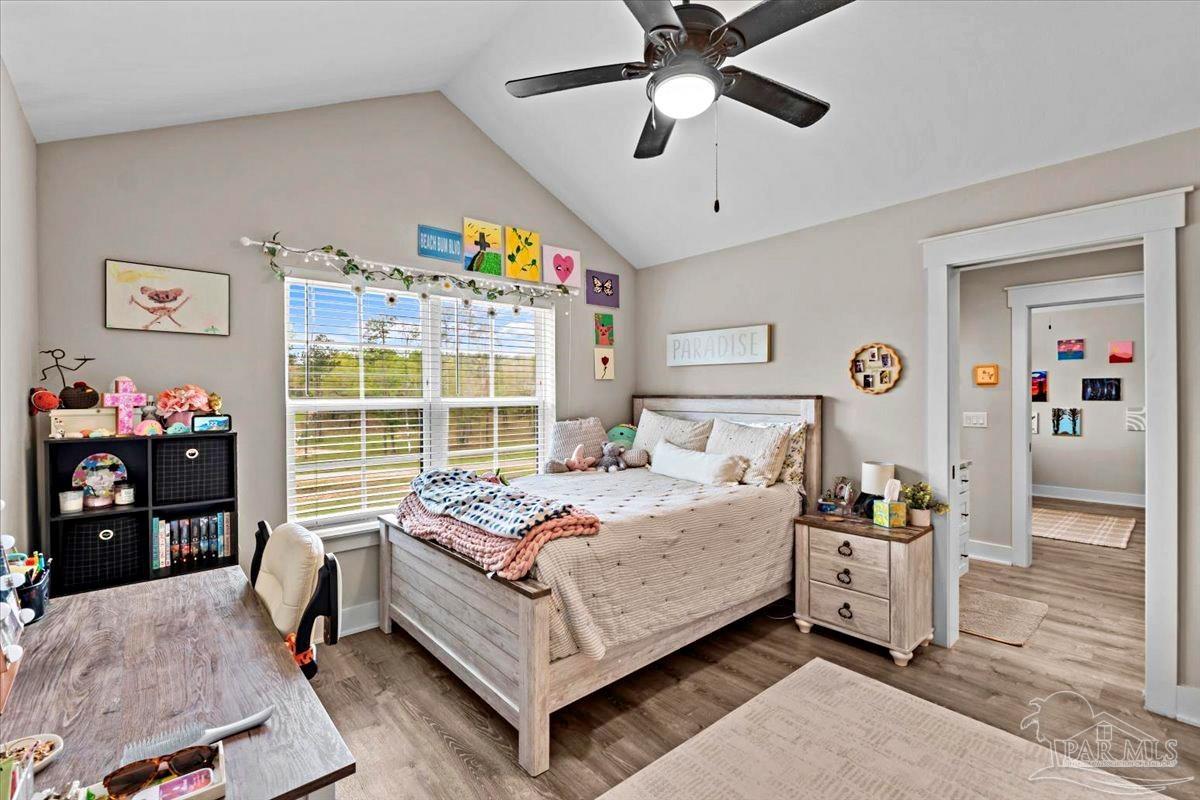 7400 Tidwell Road Pace, FL 32571 - Photo 28 of 36 a bedroom with a bed and a window