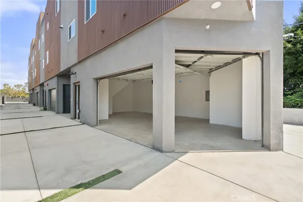 a kitchen with white cabinets appliances and a sink