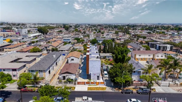 an aerial view of residential houses with outdoor space