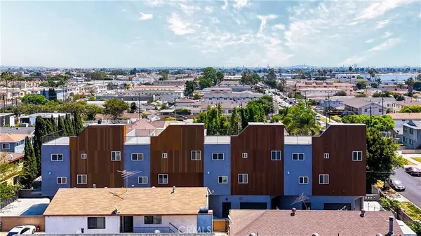 an aerial view of a house with a city view
