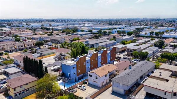 an aerial view of a city with lots of residential buildings