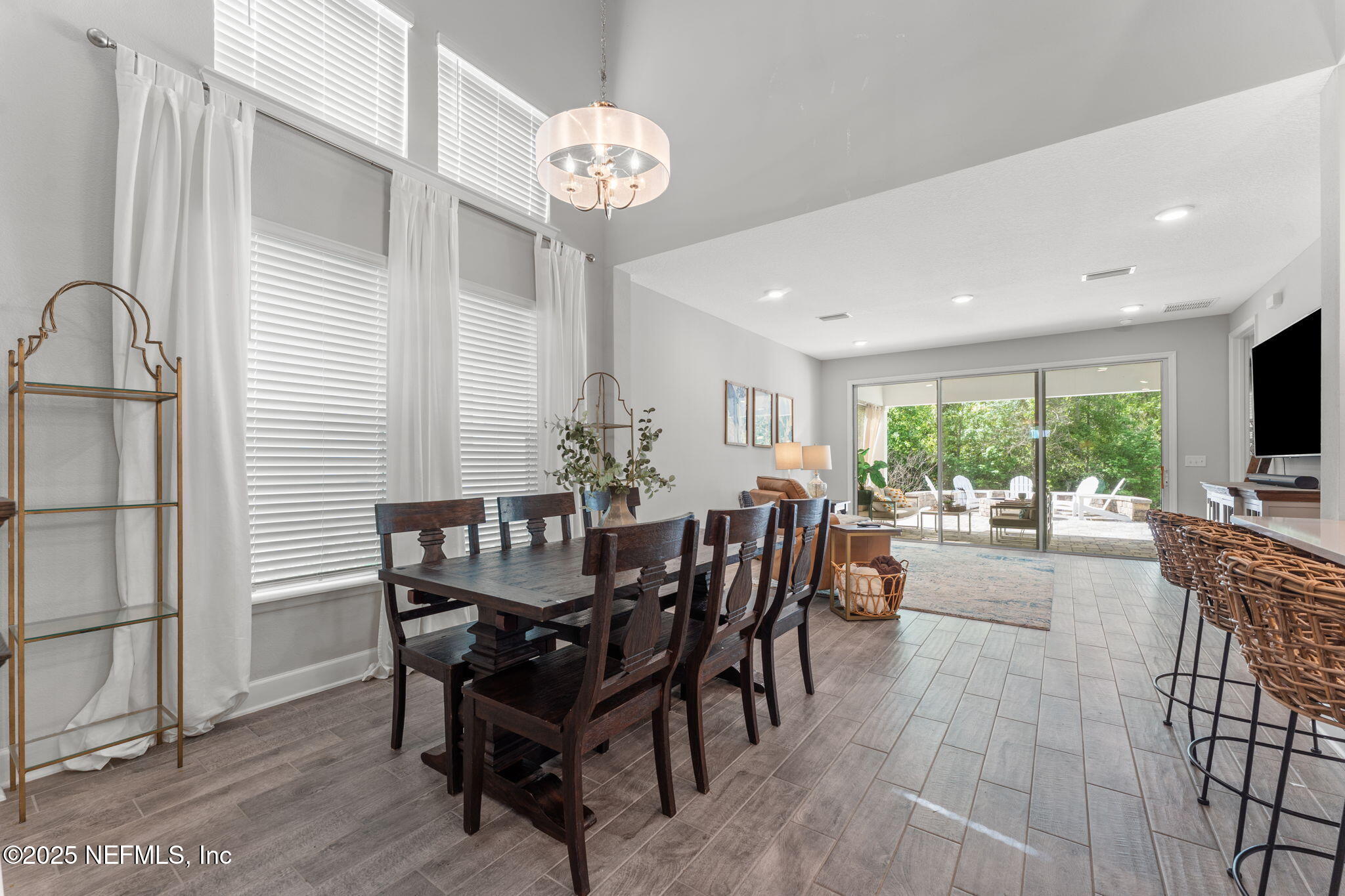 267 Windswept Way St. Augustine, FL 32092 - Photo 11 of 50 a view of a dining room and livingroom with furniture window and wooden floor